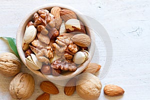 Mix of nuts in wooden bowl. Healthy and tasty snack