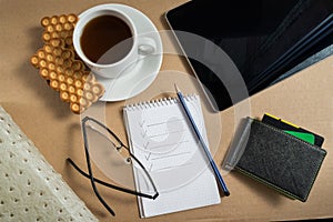 Mix of office supplies and business gadgets on office desk