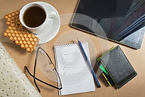 Mix of office supplies and business gadgets on office desk