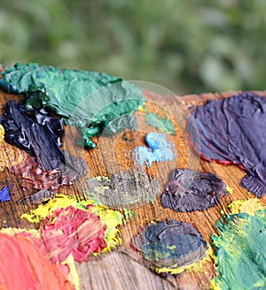 Mix of paints on handmade wooden palette.