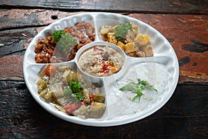 Mix plate arabic food with vegetarian spread starters on rustic wooden background