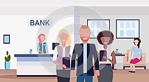 Mix race colleagues smiling banking managers standing together modern bank office interior horizontal flat