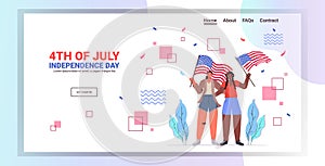 Mix race women holding usa flags girls couple celebrating 4th of july independence day concept