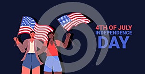 Mix race women holding usa flags girls couple celebrating 4th of july independence day concept portrait