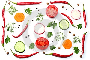 Mix red hot chili peppers with parsley and sliced cucumber and garlic isolated on white background top view