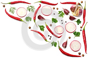 Mix red hot chili peppers with parsley and sliced cucumber and garlic isolated on white background top view