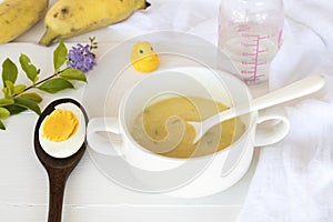 Mix rice gruel and boiled egg yolk healthy foods for baby photo