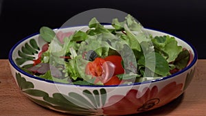 Mix Salad Falls On A green Background, Slow Motion