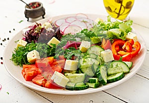 Mix salad from fresh vegetables and greens herbs.