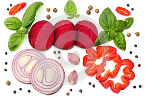 mix of slice of beetroot, red onion, basil leaf, garlic, sweet bell pepper and spices isolated on white background. top view