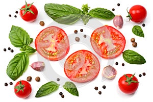 mix of slice of tomato, basil leaf, garlic and spices isolated on white background. top view