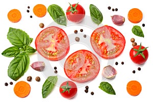 Mix of slice of tomato, basil leaf, garlic and spices isolated on white background. top view