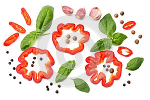 mix of slice of tomato, basil leaf, garlic, sweet bell pepper and spices isolated on white background. top view