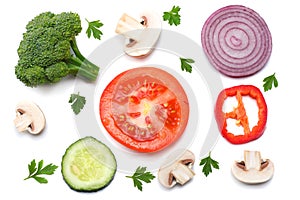 Mix of slice of tomato, red onion, parsley, mushroom and broccoli isolated on white background. Top view