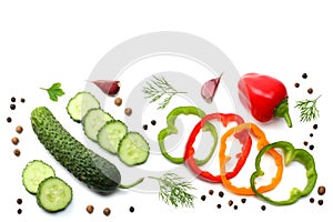 mix of sliced cucumber, garlic, sweet bell pepper and parsley isolated on white background. top view