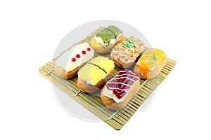 Mix Sushi Donuts in the bamboo dish.