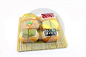 Mix Sushi Donuts in the bamboo dish.