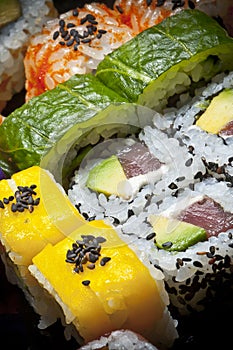 Mix of sushi and roll pieces