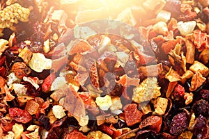 Mix tea karkade with dried fruits and flowers. Fruit tea background and texture. Top view. Food background. Organic
