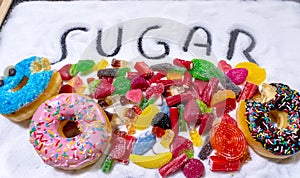 Candies donuts and sugar in writing