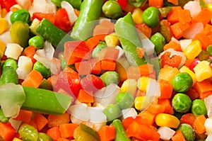 Mix of vegetable containing carrots, peas, corn close up.