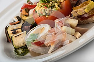Mixed appetizers with meat, egg and vegetables