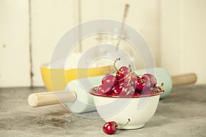 Mixed berries, baking ingredients and utensils