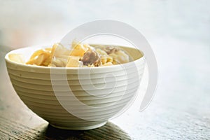 Mixed boiled vegetables soy sauce in Chinese style in white ceramic bowl.