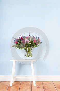 Mixed bouquet flowers on table