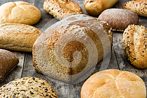 Mixed breads on wooden table