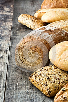 Mixed breads on wooden table