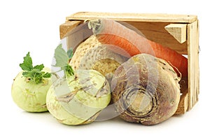 Mixed cabbage and root vegetables in a wooden crate