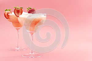 Mixed cocktails, party punch smoothies and frozen summer drinks concept with strawberry mojito or daiquiri in margarita glasses