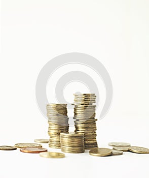 Mixed coin stacks on a white background