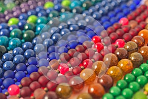 Mixed colors beads close-up made from natural stones or glass marbles