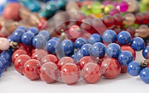 Mixed colors beads close-up made from natural stones or glass marbles