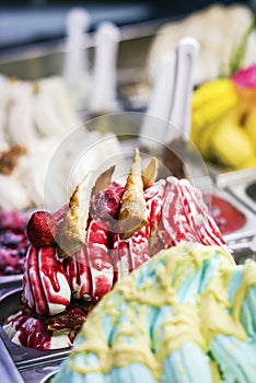 Mixed colourful gourmet ice cream sweet gelato in shop display