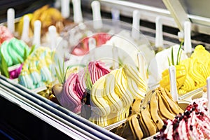 Mixed colourful gourmet ice cream sweet gelato in shop display