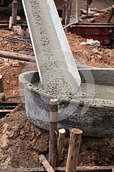 Mixed concrete pouring at construction site