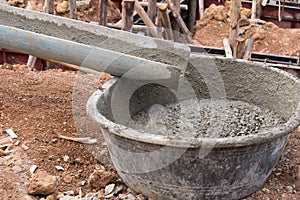 Mixed concrete pouring at construction site