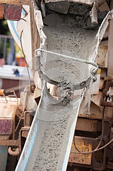 Mixed concrete pouring at construction site