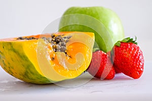 Mixed cutted fruits woth papaya, strawberrt and apple