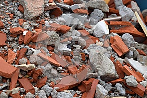 Mixed and demolished construction waste, container on a construction site with different rubble made of concrete and cement and