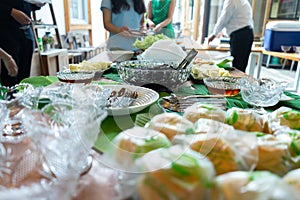 Mixed dessert in high tea break pineapple bread cream and ice black jelly with syrup on decoration leaf on wood table