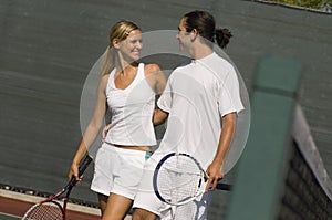 Mixed Doubles Partners standing on Court