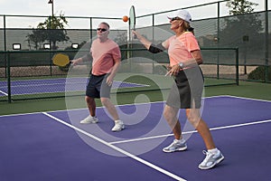 Mixed Doubles Pickleball Action - Forehand for the Point photo