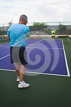 Mixed Doubles Pickleball Action - The Serve