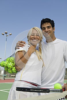 Mixed doubles Tennis Players on tennis court portrait