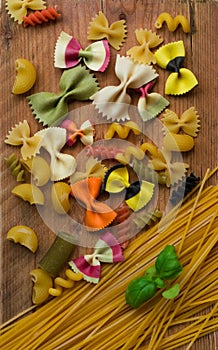 Mixed dried colored pasta selection with basil,Italian food