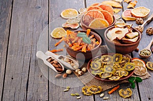 Mixed dried fruit chips, candied pumpkin slices, nuts and seeds with copy space